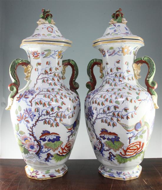 A pair of massive Masons ironstone octagonal baluster vases and cover, c.1825, 75.5cm, slight loss to one finial